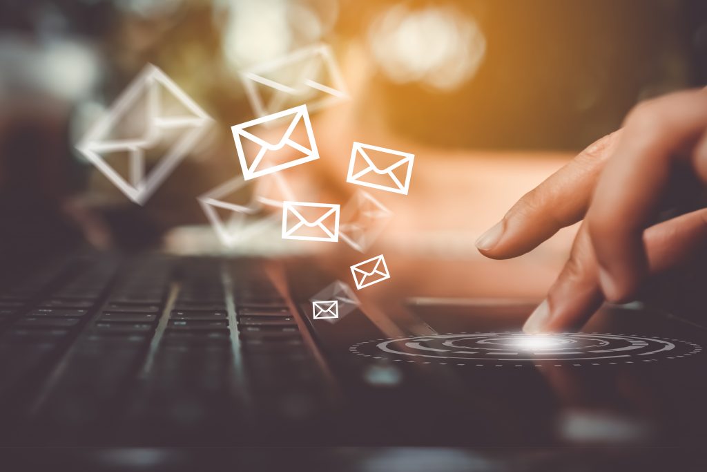 Woman hand using smartphone to send and recieve email.